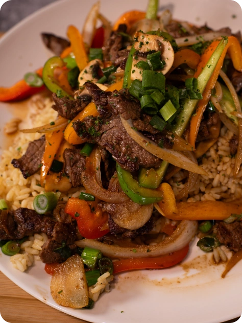 Featured Fire & Feast menu items including Steak Teriyaki, fresh salads, sandwiches, and Mediterranean specialties in Commerce Township, Michigan.