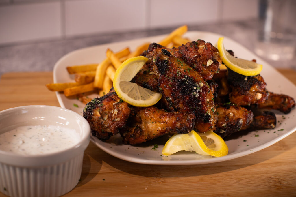 Fire & Feast Chicken Wings served fresh with your choice of sauces in Commerce Township, Michigan.