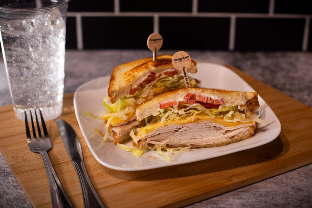 Roasted turkey and melted Gouda cheese sandwich served on grilled sourdough bread at Fire & Feast in Commerce Township, Michigan.