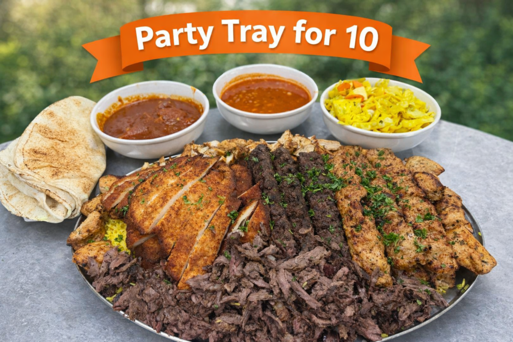 Mediterranean Combo Tray for 10 with beef kabobs, chicken kabobs, chicken tikka, beef shawarma, chicken shawarma, yellow rice, and pita bread from Fire & Feast in Commerce Township, Michigan.
