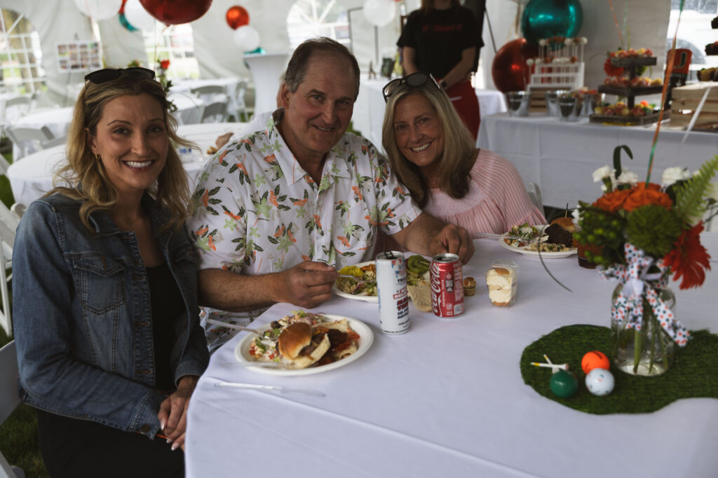 Guests enjoying Fire & Feast catering at a graduation party in Commerce Township, Michigan.