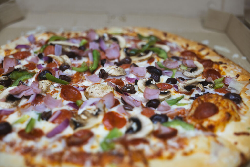 Fire & Feast artisan pizza baked with premium toppings in Commerce Township, Michigan.
