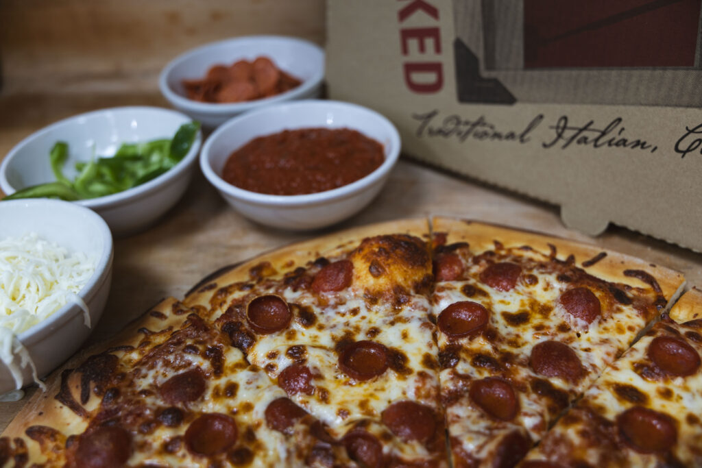 Fire & Feast handcrafted gourmet pizza baked fresh with premium toppings in Commerce Township, Michigan.